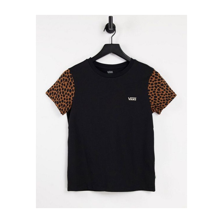 Black crewneck with tan-and-black patterned short sleeves.