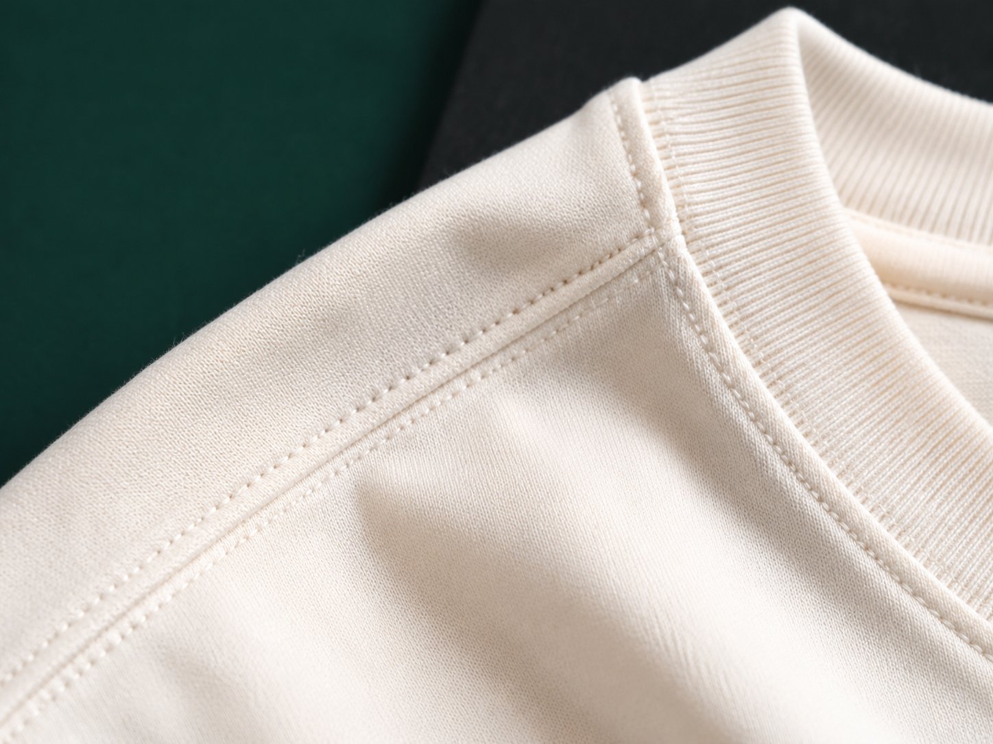 Illustrative cotton seam and ribbed neckline detail