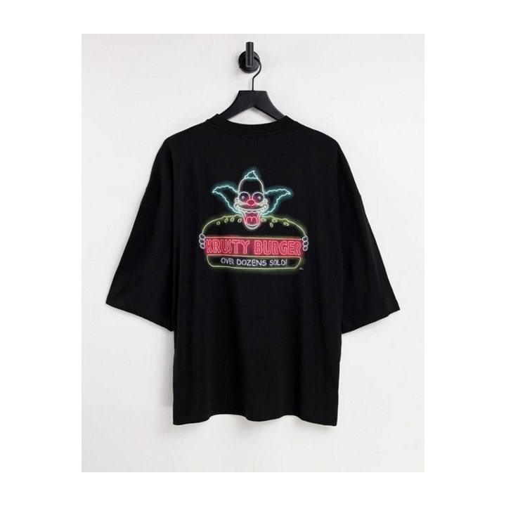Black crewneck with a multicolour alien illustration.
